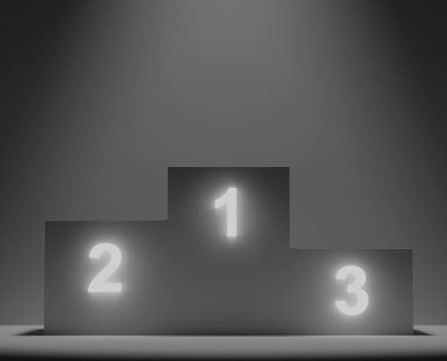 A black and white of three podium blocks numbered 1 to 3.