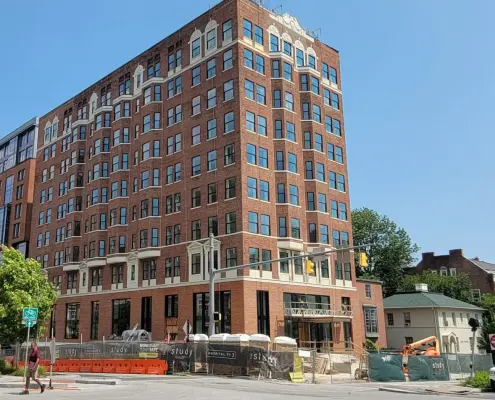 A multi-story brick hotel nearby to the Johns Hopkins campus.